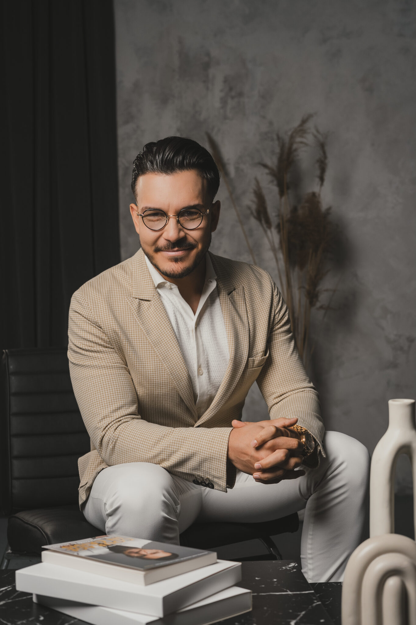 Maksim Asenov seated in a studio
